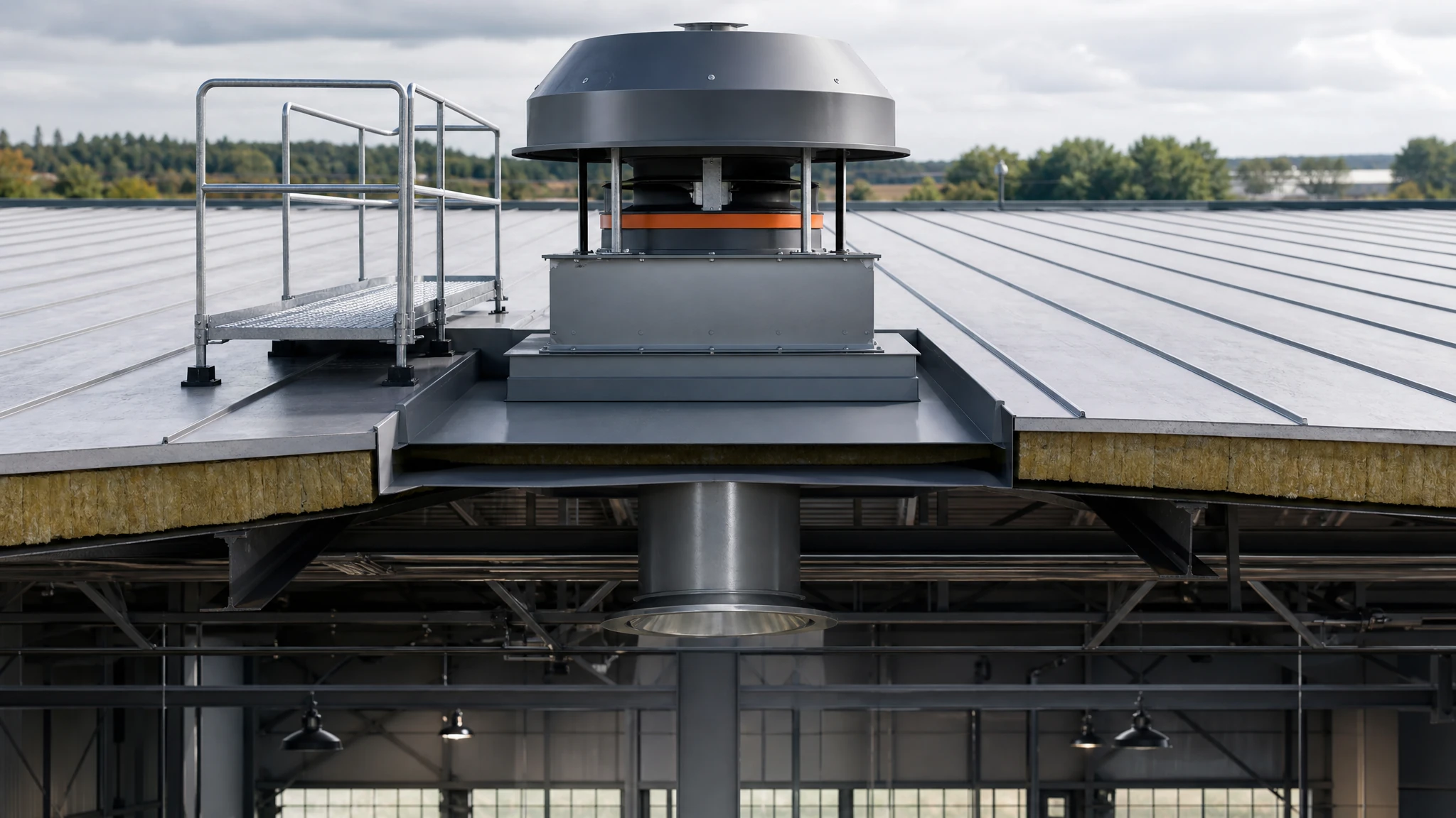 Roof-mounted factory exhaust fan on a curb with flashing and interior discharge path