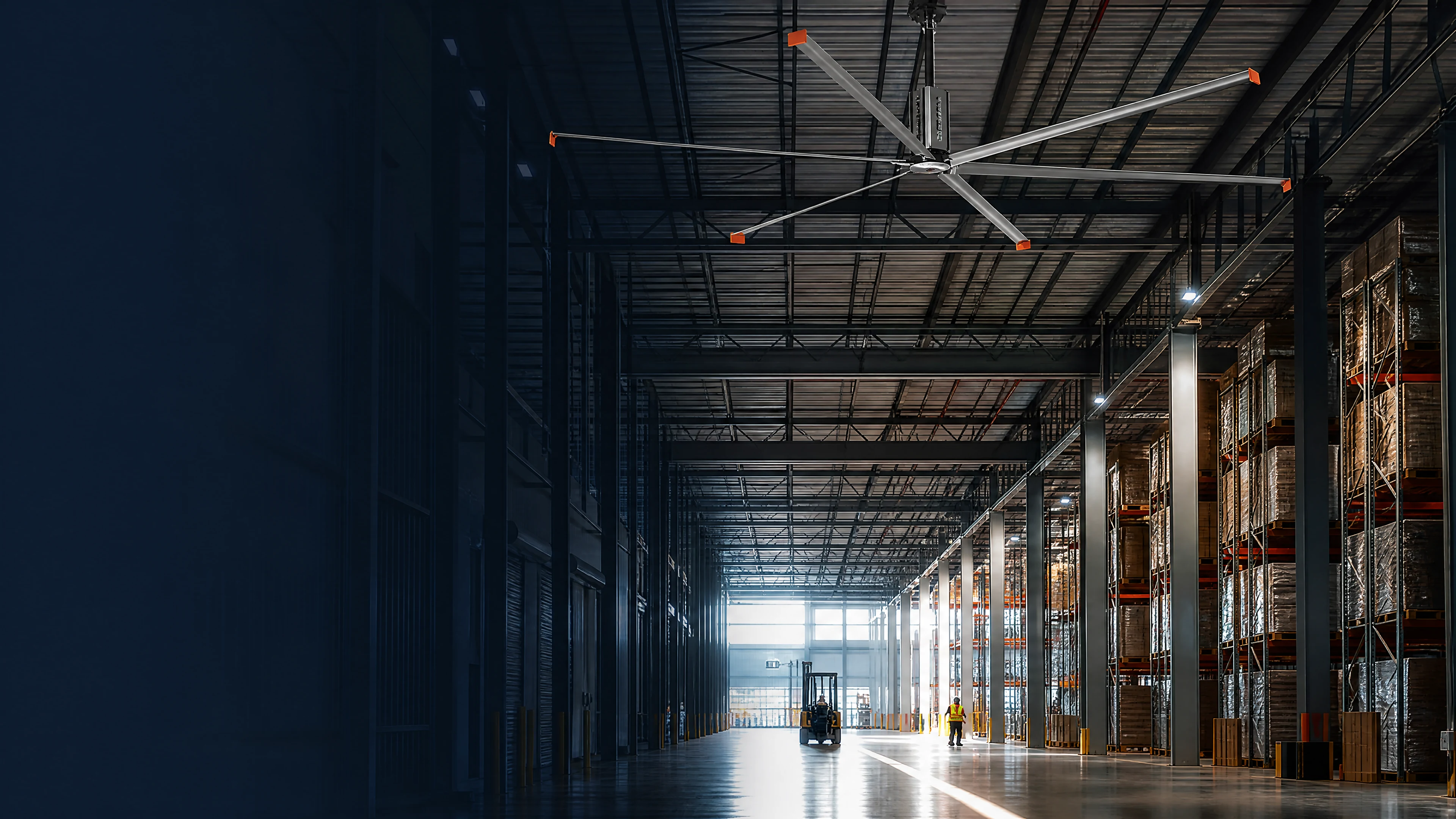 Large six-blade HVLS fan installed in a modern logistics warehouse